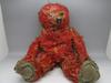 Very threadbare red teddy bear