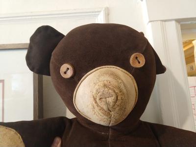 Teddy bear, eyes in buttons, feet and hands in leather…