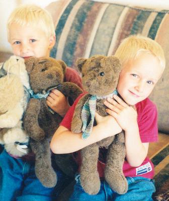 Twins with their teddy bears