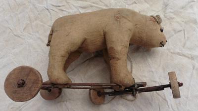 side view of bear on wheels
