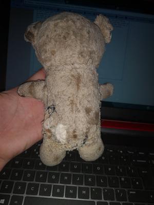 Old and tatty teddy bear