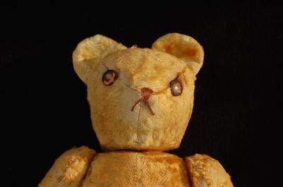 close up of old teddy bear