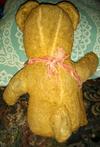 back view of old teddy bear