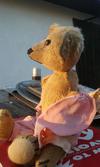 Old Bear in pink pajamas side view