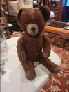 slightly tattered small Teddy bear