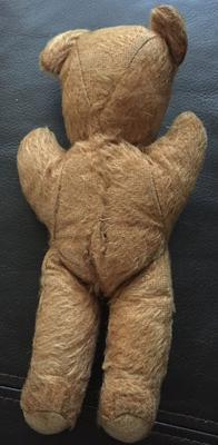 back view of old teddy bear