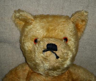 face of old teddy bear