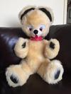 Cream teddy bear with dark paws